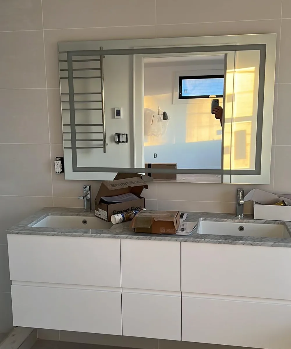Bathroom vanity with a large mirror