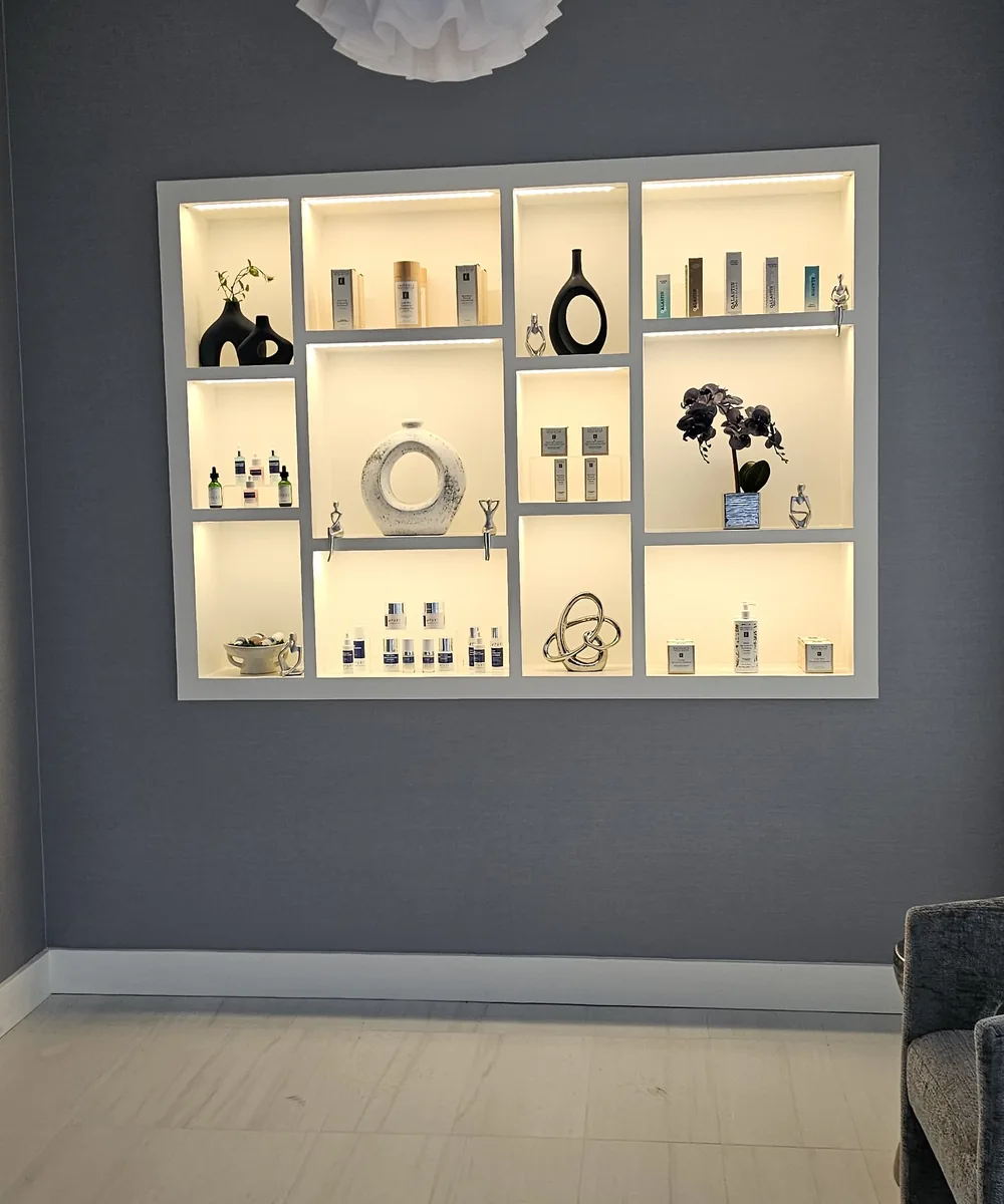 Built-in display shelves with warm interior lighting