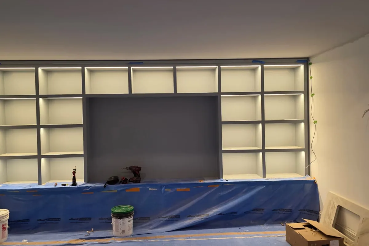 Built-in display wall with warm interior lighting