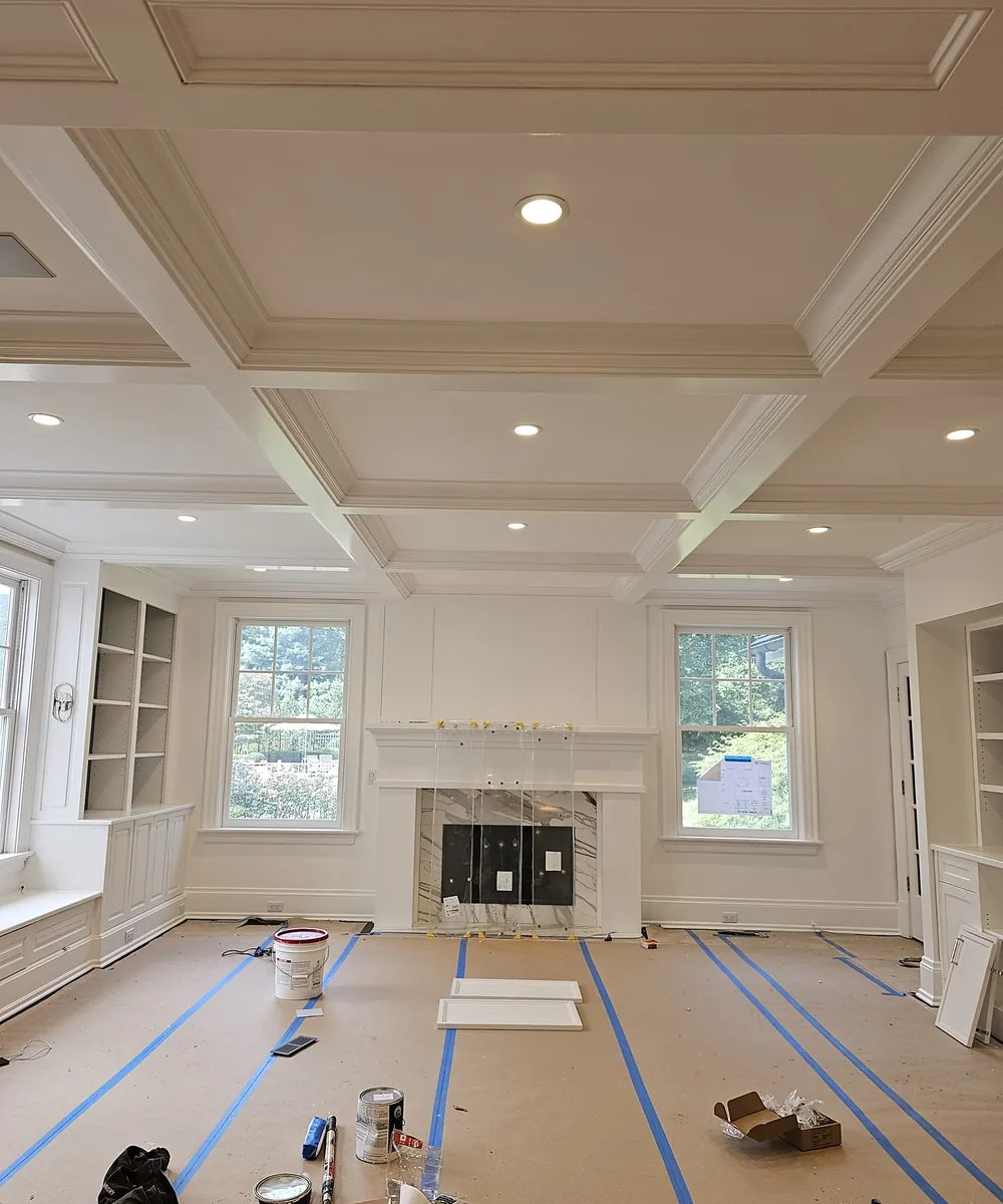 Finished interior room with trim and recessed lighting