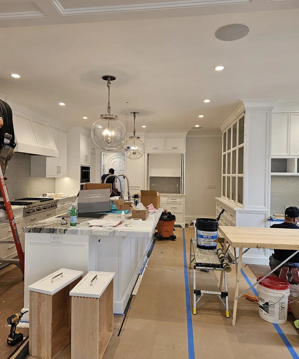 Kitchen renovation space with cabinets and fixtures in progress